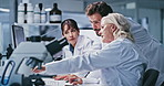 People, team and scientist with computer at lab, talk or point for review with medical research. Man, women and group with feedback, checklist and pc with pharmaceutical study for vaccine development