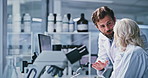 Scientist, team or computer with discussion in lab for clinical trial, medical results or innovation. Biotech, people or equipment with feedback for cancer research, vaccine development or reflection