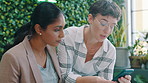 Cellphone, discussion and business women in office for planning creative project with collaboration. Technology, conversation and magazine editors with article on phone for publishing at agency.