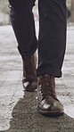 Businessman, shoes and walking in city with travel, career and morning commute for job opportunity. Professional person, feet and outdoor journey in urban town with mission, path and trip for work.