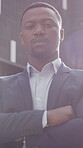 Property management, face or black man in city with arms crossed, pride or ambition as realtor. Serious, flare or real estate agent with confidence, career growth or experience in housing industry