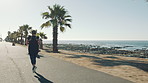 Plus size, woman and running for fitness at beach with exercise, training and cardio challenge. Back, chubby person and lose weight with workout, endurance performance and wellness goals on promenade