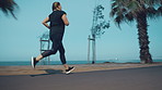 Woman, running and training for fitness at beach with exercise, endurance and sprint challenge. Athlete, person or lose weight with cardio workout, physical activity and wellness on promenade outdoor