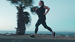Woman, running and exercise for fitness at beach with cardio, training and sprint challenge. Athlete, person and lose weight with morning workout, physical activity and wellness on promenade outdoor