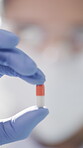 Medical, solution or hands in lab with pill, drug testing or product exam in vaccine development. Research, person or scientist with medication, breakthrough or capsule cure in pharmaceutical study.