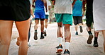 Legs, people and marathon competition in nature for fitness challenge, sport event and running. Runners, shoes of group and race contest at park for endurance test, jogging pace or cardio performance