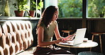 Laptop, phone and remote work with woman in coffee shop for communication, planning or research. App, computer and typing text message with freelance employee in cafe or restaurant for review