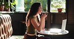 Thinking, drinking coffee and woman in cafe, laptop and decision for project, caffeine and morning. Freelance writer, herbal tea or person in restaurant, creativity or reflection with ideas for story