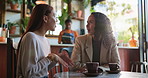 Women, wow and gossip in coffee shop for support, reunion and lunch break. Girls, talking and drink in cafe for bonding, communication and social gathering or hangout with latte in small business