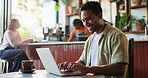 Laptop, typing and man in coffee shop with freelance project for creative career with email. Technology, warm beverage and male editor with computer working on publishing in cafe or restaurant.