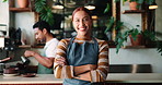 Crossed arms, woman and face of server in coffee shop for confidence in hospitality career. Smile, small business and portrait of female waitress with pride for customer service at cafe in Colombia.