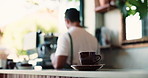 Coffee, cup and counter in cafe with steam, small business worker and barista for customer service. Mug, morning beverage and espresso on table with man, drink order preparation and waiter at store.
