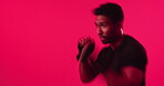 Exercise, boxing and man in studio for training, self defense or workout on red background. Sports, athlete and person with gloves for competition, fitness or practice for wellness, energy or routine