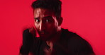 Face, fitness and punch with boxer man in studio for sports, training or workout routine. Boxing, power and strike with athlete person isolated on red background for combat, fight or self defense