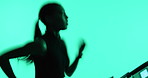 Woman, running and treadmill with speed in studio for fitness, cardio and neon at training center. Person, exercise gear and workout on equipment, steps or profile for wellness, fast or runner at gym