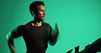 Treadmill, running and man with fitness in studio, speed training and endurance practice for workout. Challenge, motion blur and athlete with exercise machine for cardio, active and green background