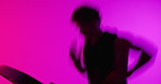 Running, treadmill and man in studio, fitness and cardio workout on pink background. Athlete, space and person with machine, equipment for exercise and challenge for wellness, health and endurance