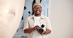 Photographer, face or black man on set with camera, pride or job goals in media agency. Confidence, laugh or cameraman in studio with photoshoot equipment, career or experience in film industry.
