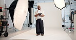 Photographer, face or black man in studio with camera, pride or job goals in media agency. Confidence, portrait or cameraman on set with photoshoot equipment, career or experience in film industry.