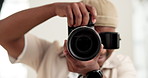 Man, photographer and lens of camera in studio for production, photoshoot and capture picture. Face, male person and focus with equipment for photography, filming and videography for content creation
