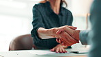 Paperwork, people or handshake at desk in office, partnership agreement or joint venture contract. Deal, teamwork or staff shaking hands for investment project merger, meeting or profit opportunity