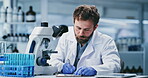 Writing, research and man with microscope, lab and medical study for mRNA vaccine and pharmaceutical. Serious, scientist and notes for HIV cure development, innovation and person with equipment