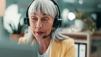 Call center, headset and woman in office, computer and consultation for help desk. Mature person, telemarketing and employee in workplace, discussion or contact us for customer service or feedback