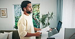 Man, laptop and video call with documents in home for finance planning, client query and remote work. Freelance financial advisor, tech and webinar with earphones for report feedback, advice and help