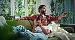 Happy, phone and couple on sofa for watching tv for bonding, connection and talking on weekend. Relax, home and man with woman on smartphone for entertainment, social media and relationship together