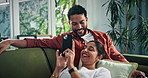 Couple, relax and conversation on sofa with phone, scroll social media and bonding together on weekend. Happy, people and talk in home with tech, browsing website and commitment in healthy marriage.