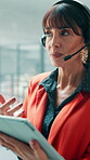 Call center, tablet and woman in agency with headset, contact us or advice in crm service. Professional, tech and mature consultant in office with mic, online assistance or feedback in client support