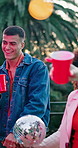 Man, friends and dancing with alcohol outdoor, social gathering and rhythm at rave party. Bokeh, people and moving with disco ball, listening to music and celebration with energy for festive reunion
