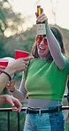 Happy, woman and dancing with alcohol at party, social gathering and rhythm at rave event. Bokeh, smile and friends with disco ball, listening to music and celebration with energy for festive reunion