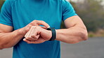 Fitness, hands and man with smart watch in road for pace timer, start running and track performance. Runner, person and set stopwatch outdoor for workout app, monitor heart rate and wellness progress