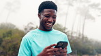 Laughing, athlete and black man with smartphone, outdoor or texting with contact on social media app. Typing, online and person with mobile for communication, fitness and runner with funny message