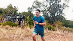 Fitness, nature and man running outdoor for workout, training or health on mountain. Sports, wellness and male athlete with cardio exercise in forest with challenge, active or energy in morning.