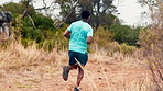 Running, nature and back of black man for fitness, exercise and cardio workout for wellness. Athlete, mountain and person outdoor with active hobby for health, endurance and challenge for training