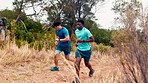 Fitness, mountain and men outdoor with running, workout or training for marathon or race. Health, sports and male athletes with cardio exercise for wellness, active or body goals in countryside.