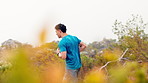 Fitness, mountain and man outdoor with running, workout or training for marathon or race. Health, sports and male athlete with cardio exercise for wellness, active or body goals in countryside.