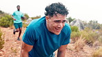 Tired, athlete and man in nature, sweating and practice for marathon, wellness and exercise routine. Outdoor, runner and person with fatigue, running and workout for fitness, breathing and exhausted