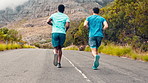 Men, running and friends with fitness on mountain road for cardio workout, benefits and wellness. People, runner and back with training, exercise and fast in nature, street and outdoor on hill