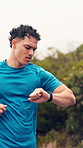 Running, fitness and man with smart watch in nature for exercise, cardio workout and training for wellness. Sports, athlete and person with active hobby for tracking, endurance and health outdoor