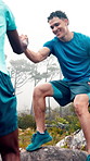 Mountain, help and men on rock for exercise, hiking and trekking for health, wellness and adventure. Athlete, friends and people with support for workout, fitness and training together in nature