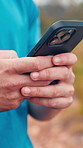 Cellphone, hands and man outdoor for fitness with texting, communication or chatting on mobile app. Technology, sports and male person with phone for online workout, exercise or training in nature.