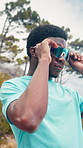Fitness, man or photochromic sunglasses in nature for UV protection, start cardio or getting ready. Low angle, black person or transition lenses outdoor for workout gear, exercise comfort or wellness