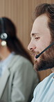 Call center, headset and man in workplace, talking and communication for system solution. Person, consultation and employee in office, discussion and feedback for customer service, crm or contact us
