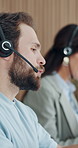 Call center, headset and man in office, conversation and communication for system solution. Person, contact us and employee in workplace, talking and feedback for help desk, advice or consultation