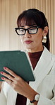 Business, woman and reading with tablet in office for research, email client and real estate. Mature person, review and digital to review schedule, price property and online inquiry of resale listing
