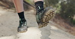 Nature, stretching and man with sneakers, hiking and warm up for fitness, legs and wellness. Outdoor, person and hiker with shoes, exercise for health benefits and footpath for journey and balance