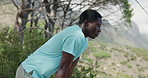 Hiking, tired and black man in forest, fitness for health benefits and challenge for trekking. Nature, person and hiker in woods, burnout and rest for training, endurance and exhausted with fatigue